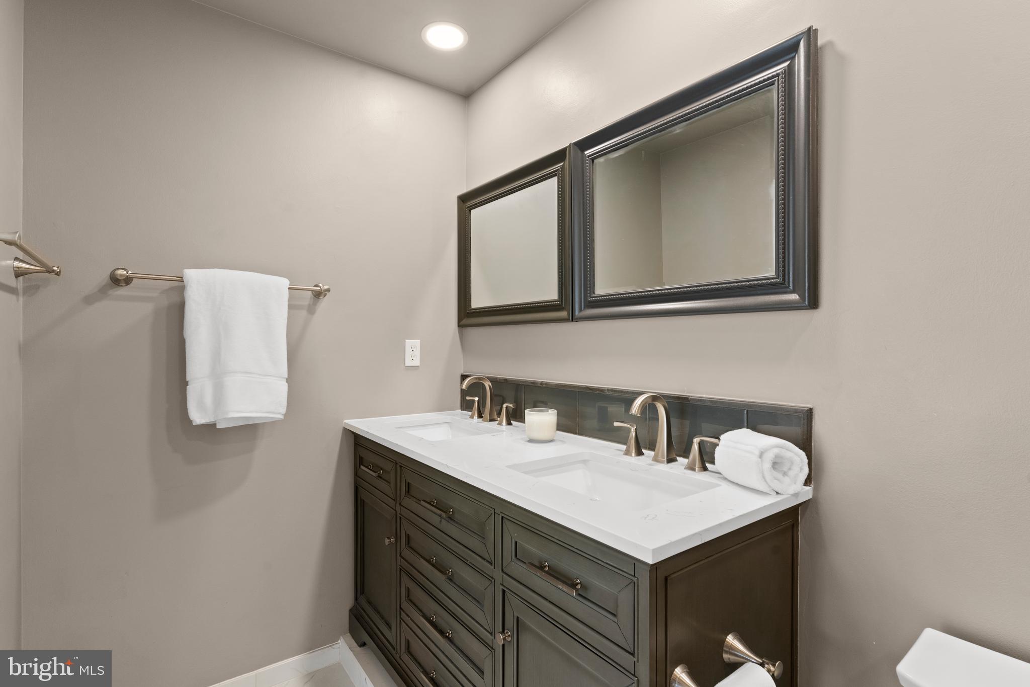 7823 Sabre Court Manassas, VA 20109 - Photo 23 of 39 a bathroom with a sink and a mirror
