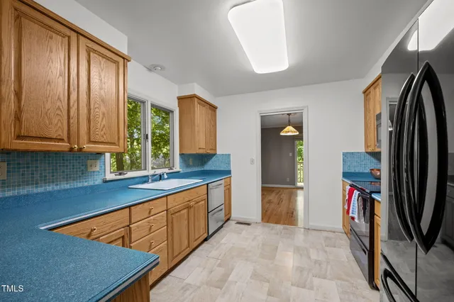 a view of a sink and a window