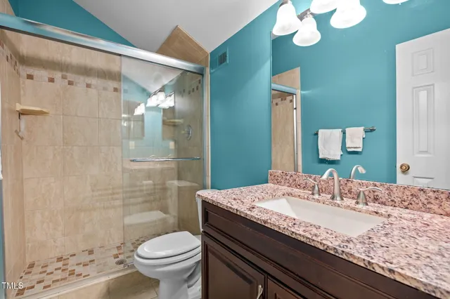 a view of a room with a ceiling fan and a window