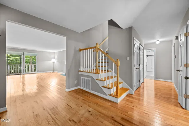 a view of an entryway with wooden floor
