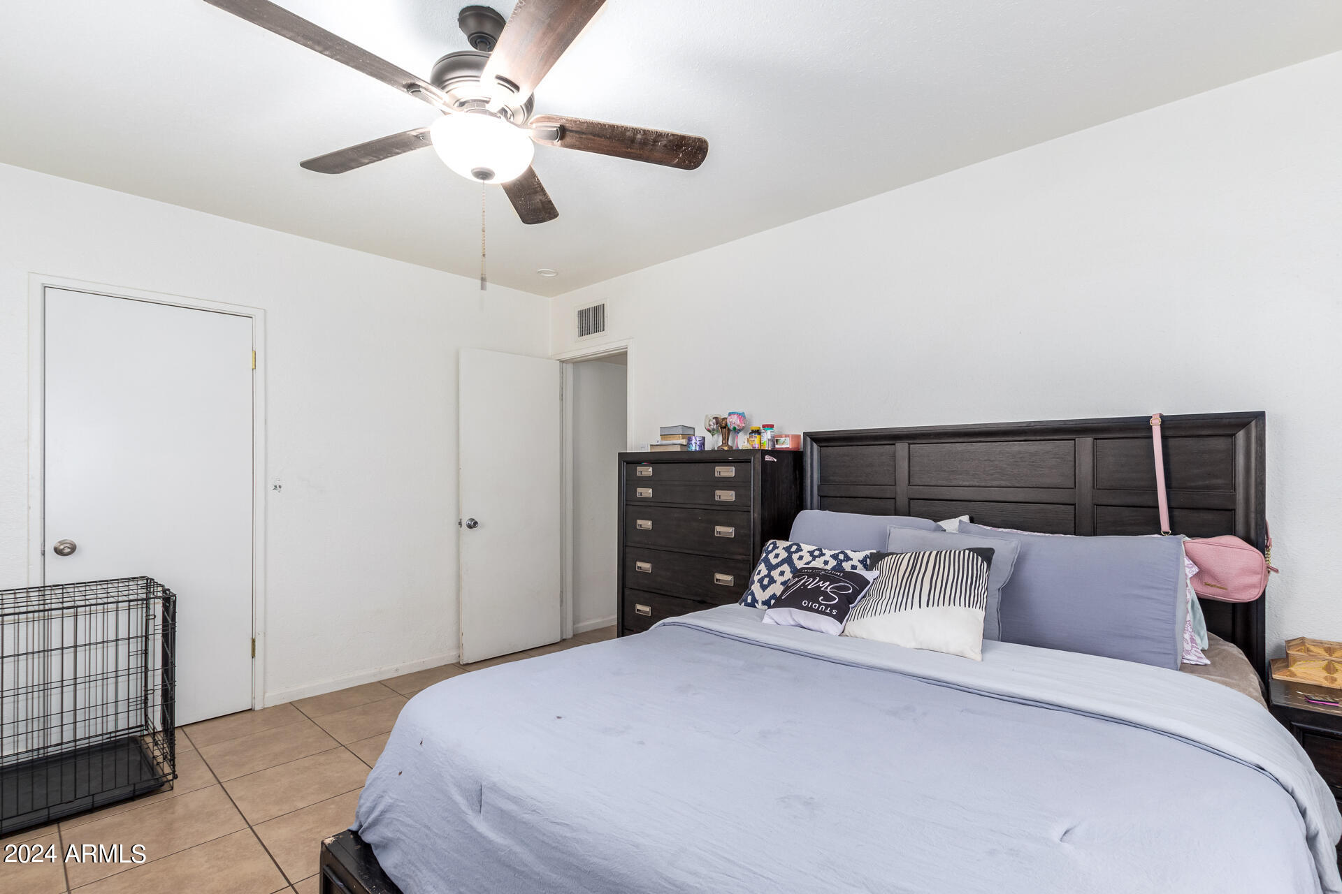 3845 North 15th Avenue Phoenix, AZ 85015 - Photo 14 of 28 a bedroom with a bed and a window