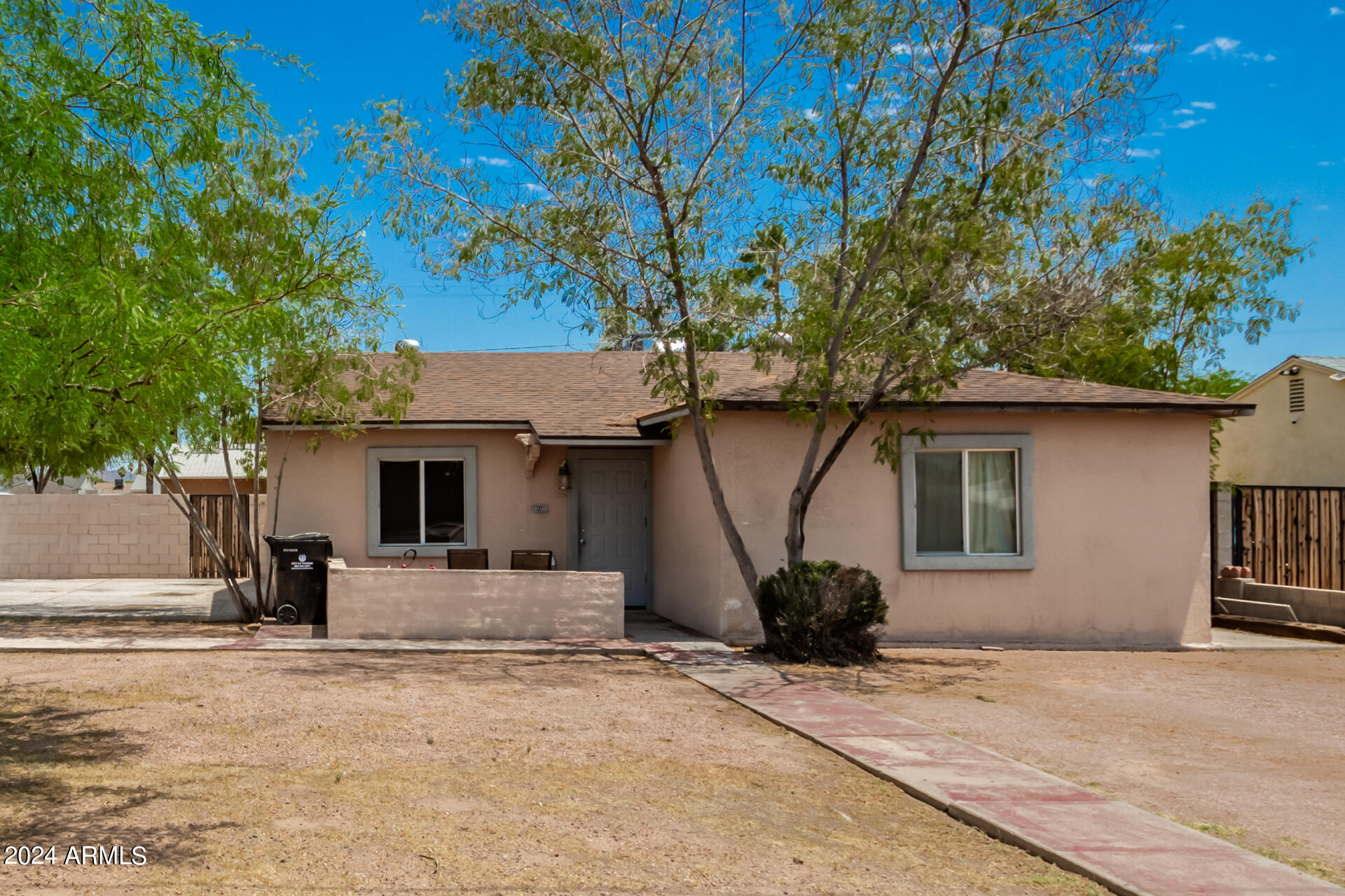 3845 North 15th Avenue Phoenix, AZ 85015 - Photo 19 of 28 a view of a house with a tree in front of it