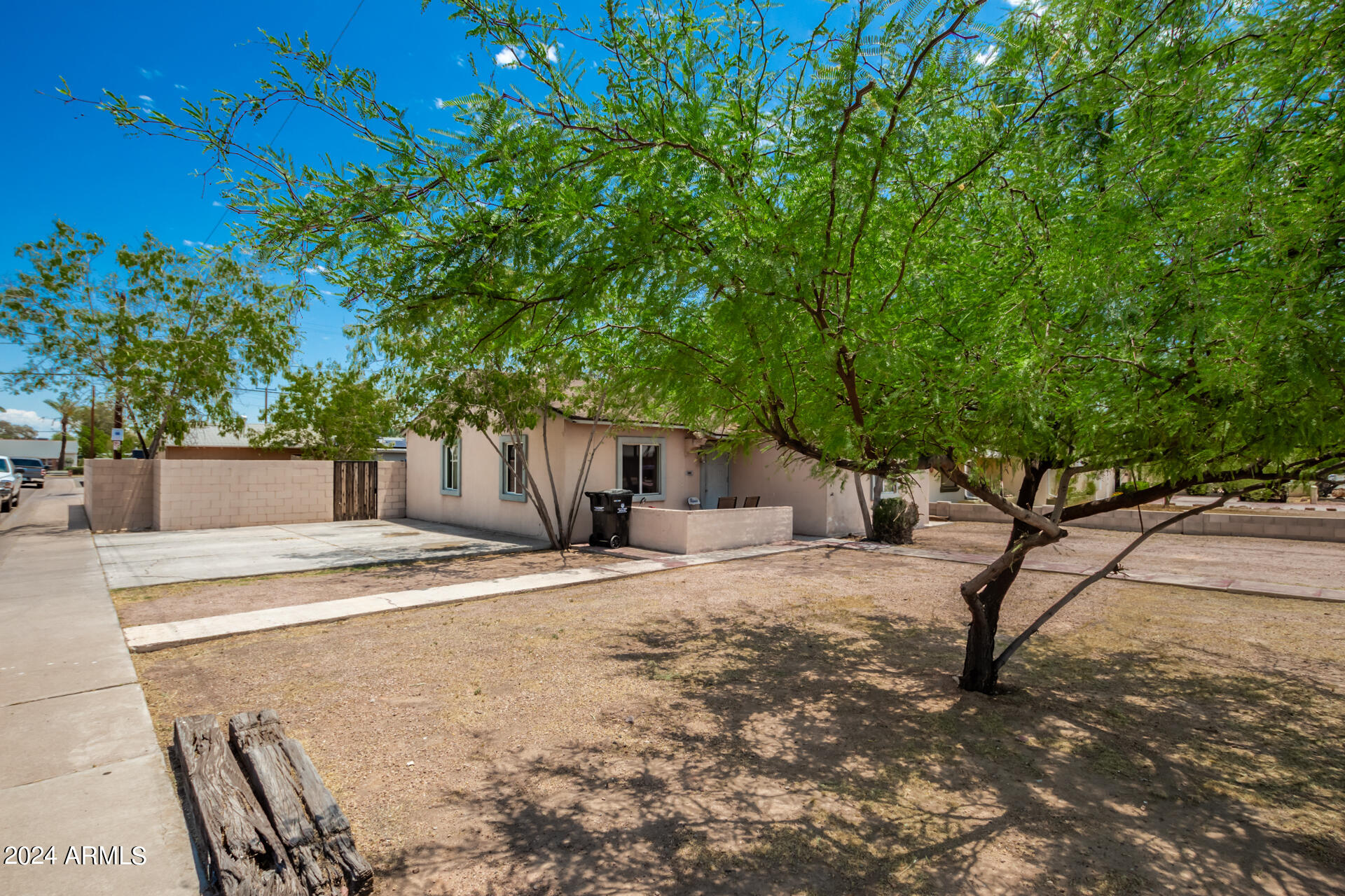3845 North 15th Avenue Phoenix, AZ 85015 - Photo 21 of 28 a white house that has tree in front of it