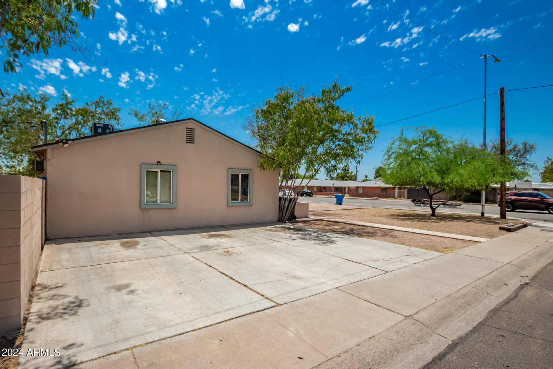 3845 North 15th Avenue Phoenix, AZ 85015 - Photo 22 of 28 a backyard of a house with plants and trees