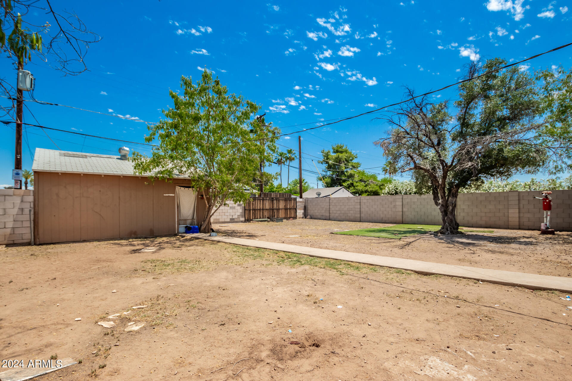 3845 North 15th Avenue Phoenix, AZ 85015 - Photo 24 of 28 a house with trees in front of it