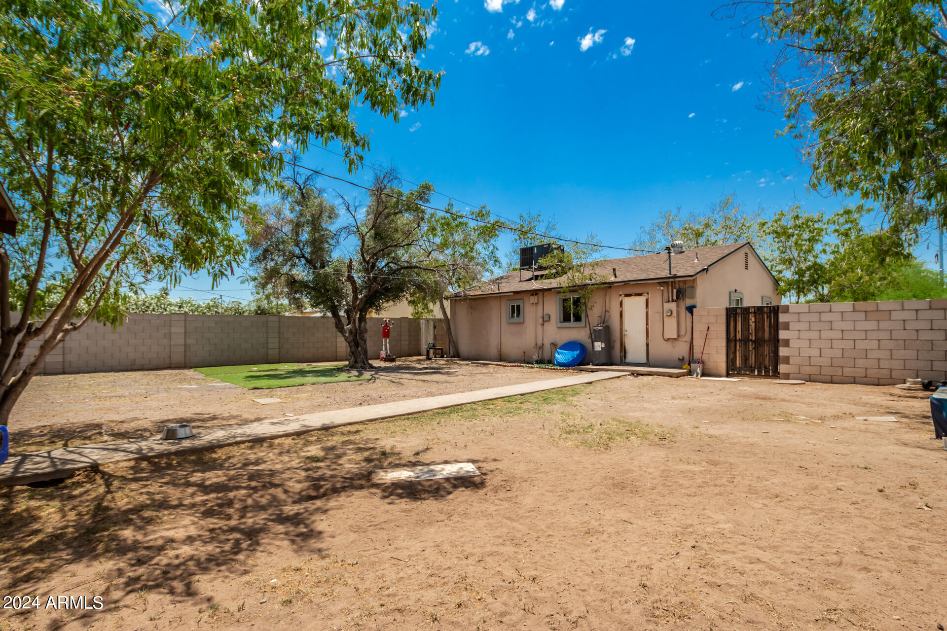 3845 North 15th Avenue Phoenix, AZ 85015 - Photo 25 of 28 a front view of a house with a yard and garage