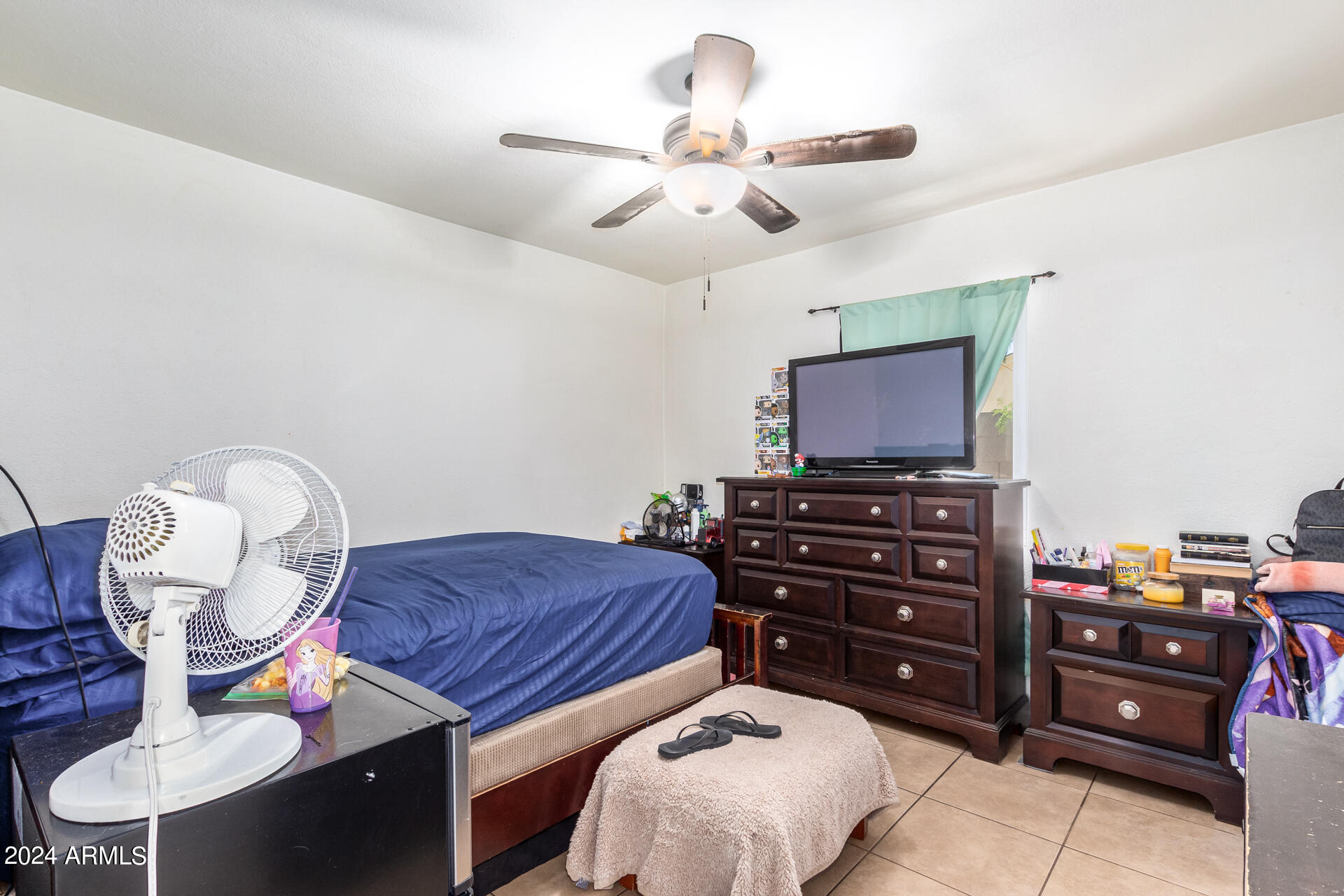 3845 North 15th Avenue Phoenix, AZ 85015 - Photo 10 of 28 a bedroom with a bed and wooden floor