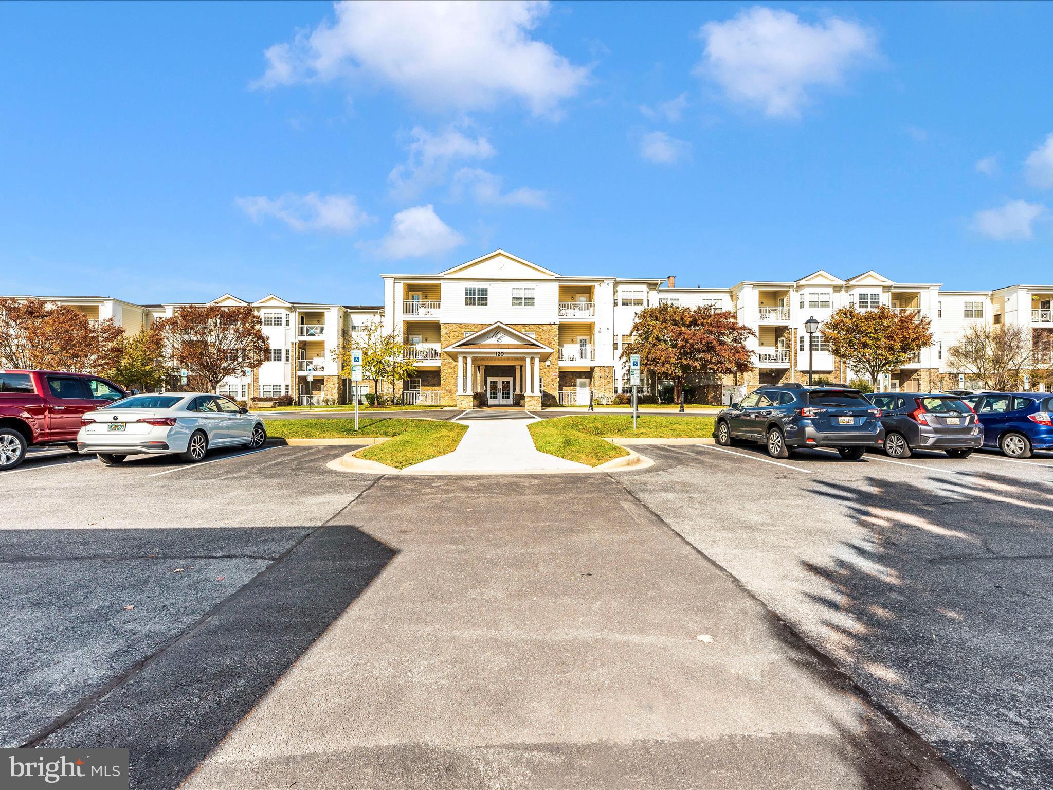120 Burgess Hill Way, Unit 207 Frederick, MD 21702 - Photo 2 of 67 a view of building with cars parked