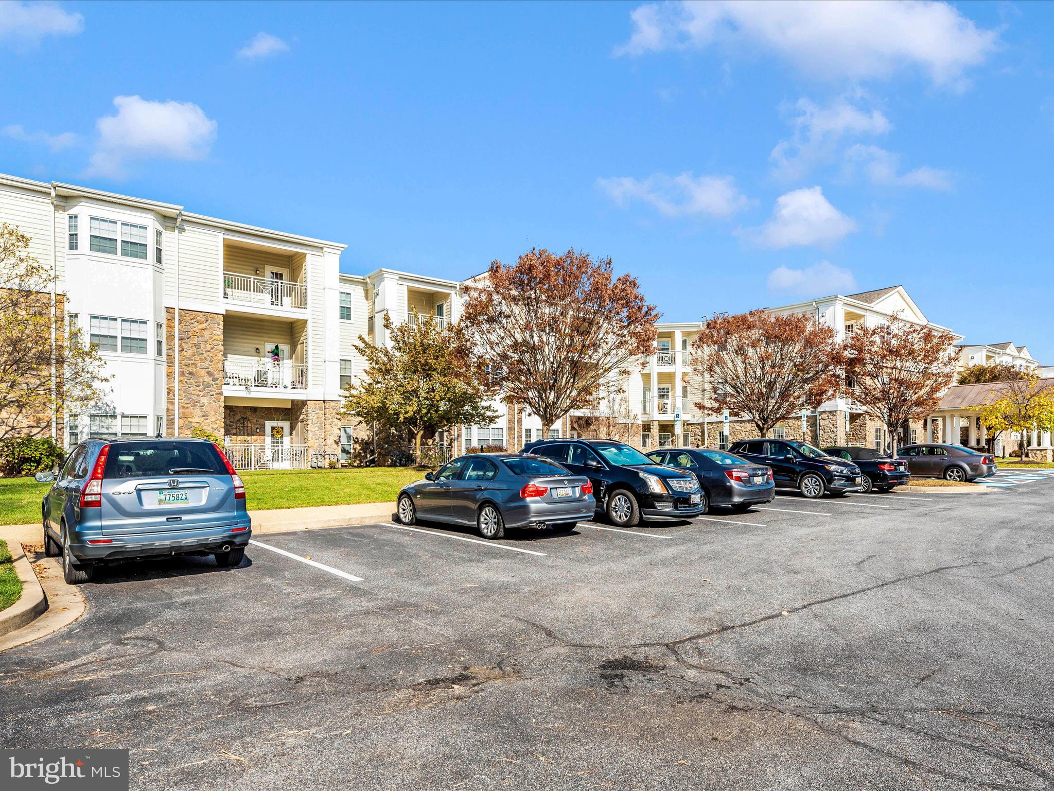120 Burgess Hill Way, Unit 207 Frederick, MD 21702 - Photo 55 of 67 a view of a cars parked in front of a building