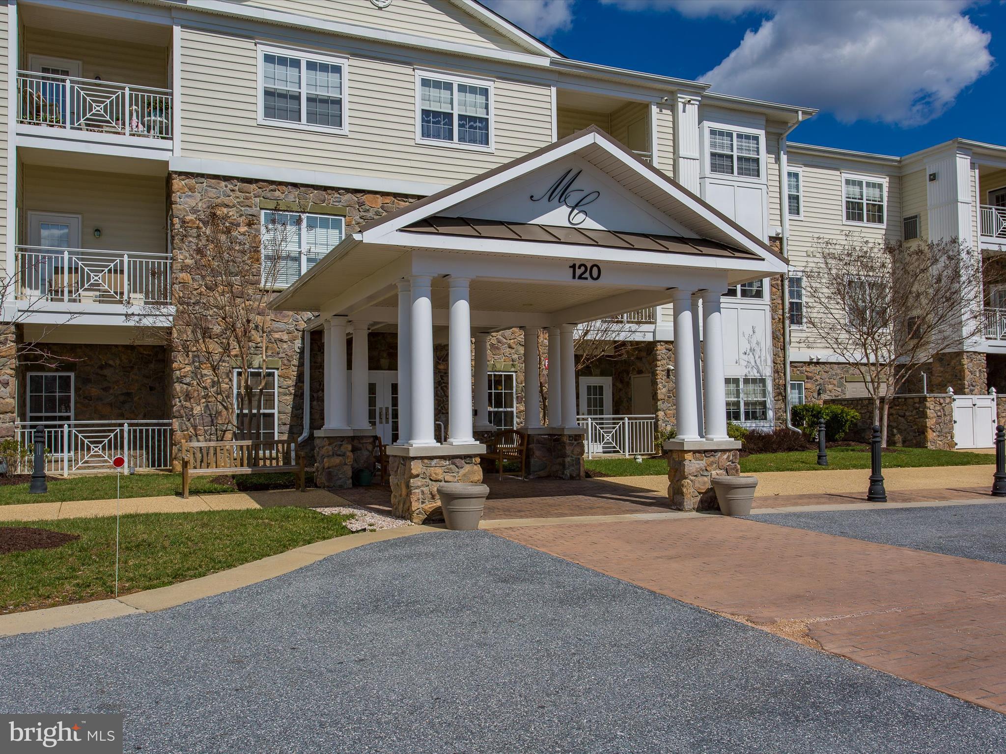 120 Burgess Hill Way, Unit 207 Frederick, MD 21702 - Photo 61 of 67 a front view of a house with a yard