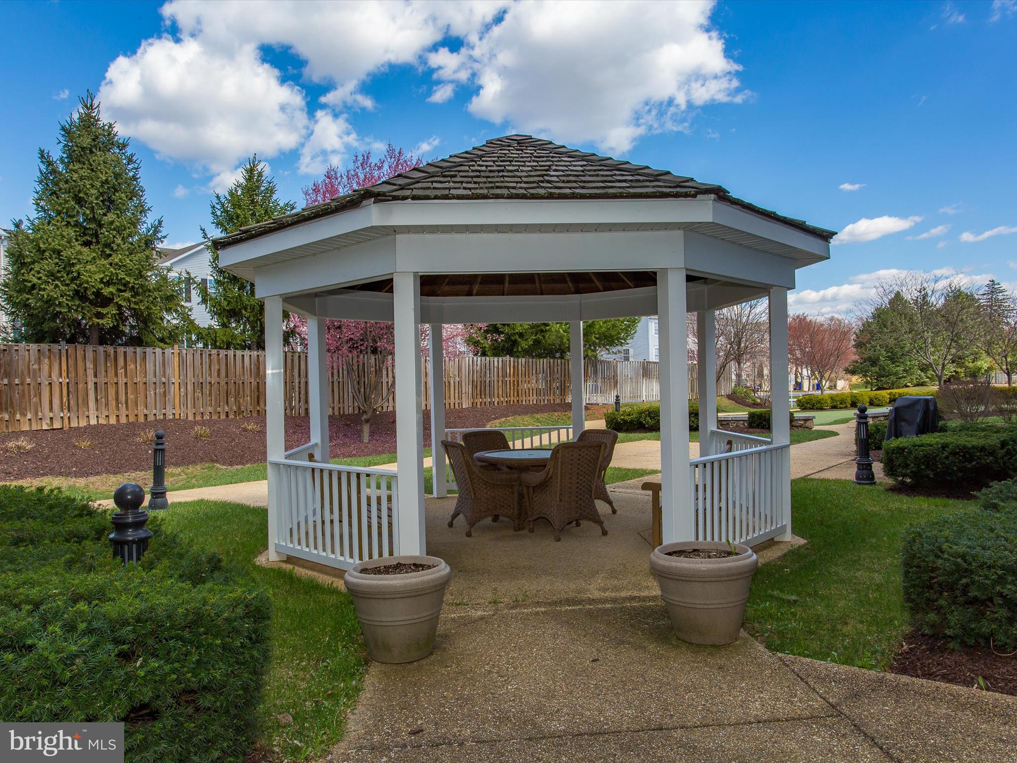120 Burgess Hill Way, Unit 207 Frederick, MD 21702 - Photo 65 of 67 a view of a house with backyard and sitting area