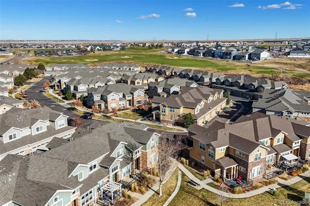 a picture of a room with a door and a microwave