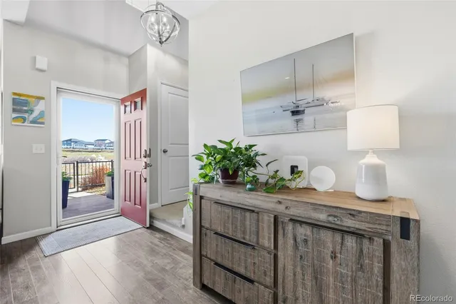 a hallway with sink and wooden floor