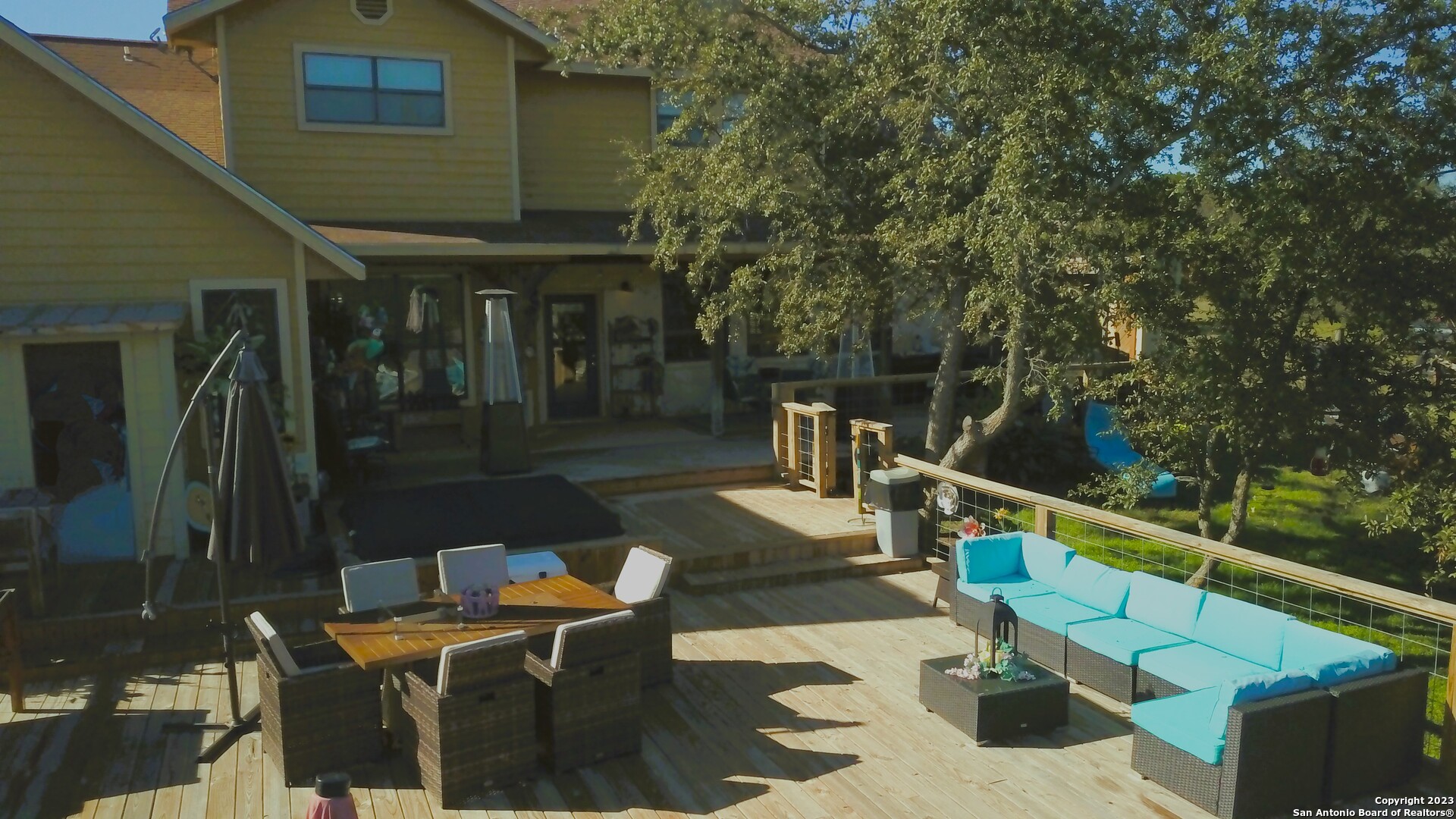 3245 Fm 470 Bandera, TX 78003 - Photo 12 of 58 a view of a patio with couches table and chairs and potted plants