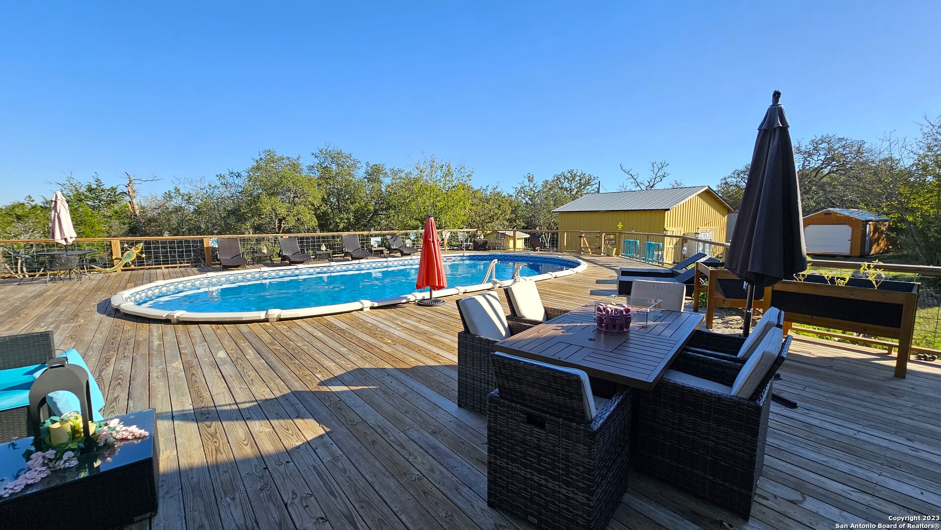3245 Fm 470 Bandera, TX 78003 - Photo 15 of 58 a view of a balcony with furniture and wooden floor