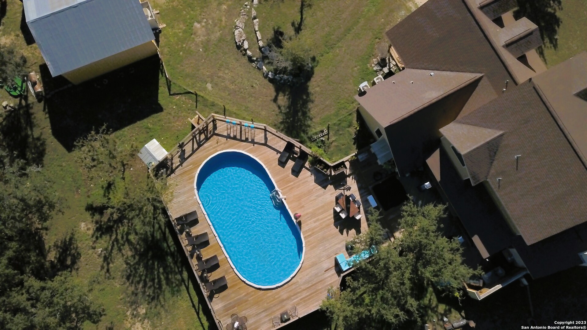 3245 Fm 470 Bandera, TX 78003 - Photo 2 of 58 an aerial view of a house with swimming pool and porch