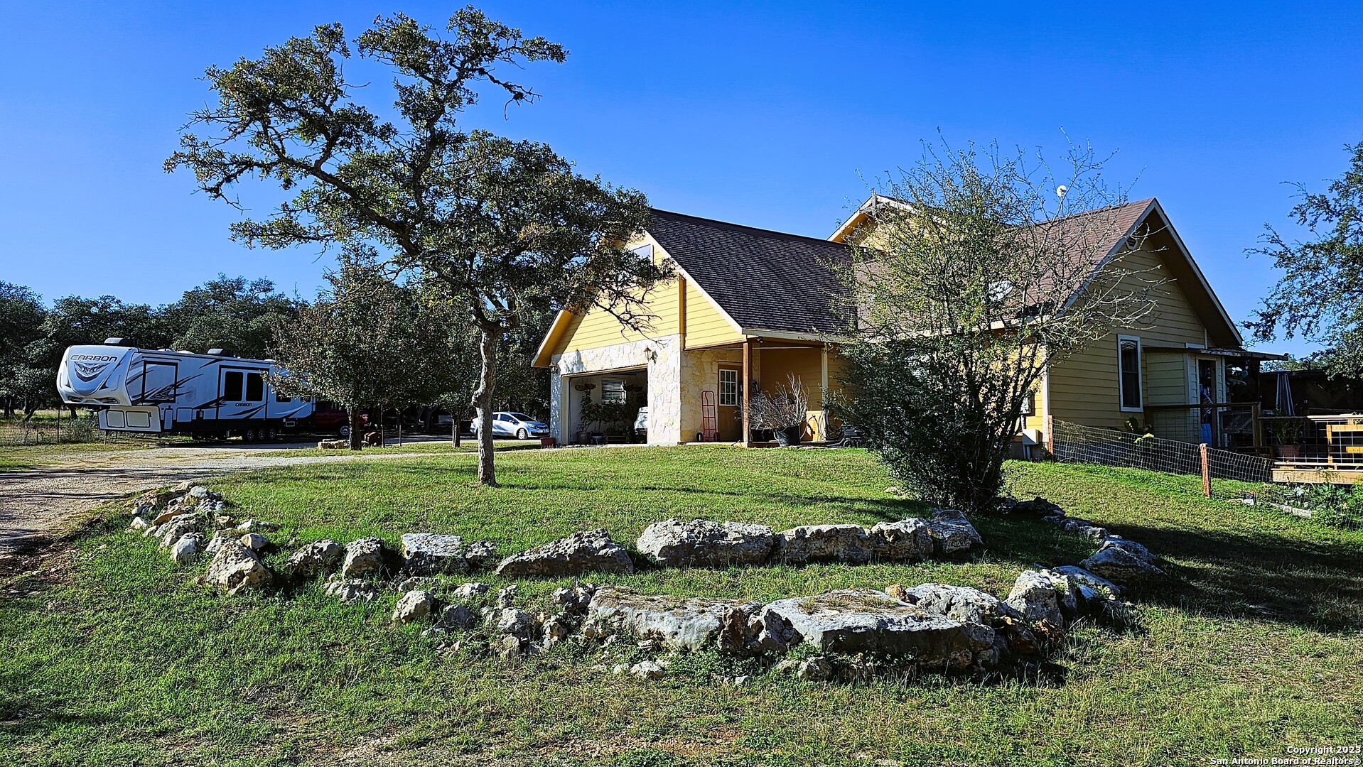 3245 Fm 470 Bandera, TX 78003 - Photo 24 of 58 a view of a house with a yard