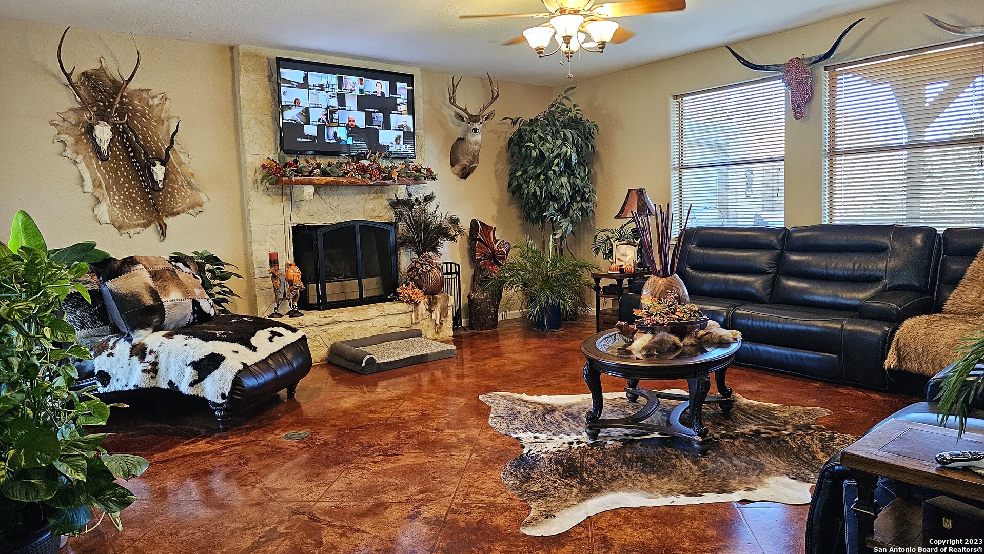 3245 Fm 470 Bandera, TX 78003 - Photo 27 of 58 a living room with furniture a fireplace and a chandelier