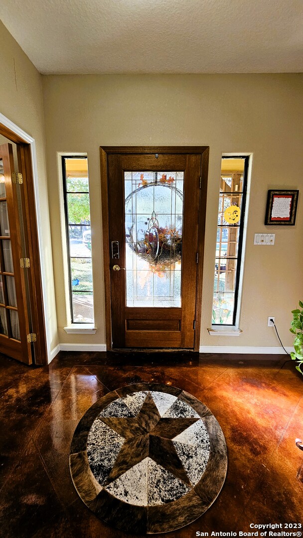 3245 Fm 470 Bandera, TX 78003 - Photo 31 of 58 a view of a room with wooden floor and a fireplace