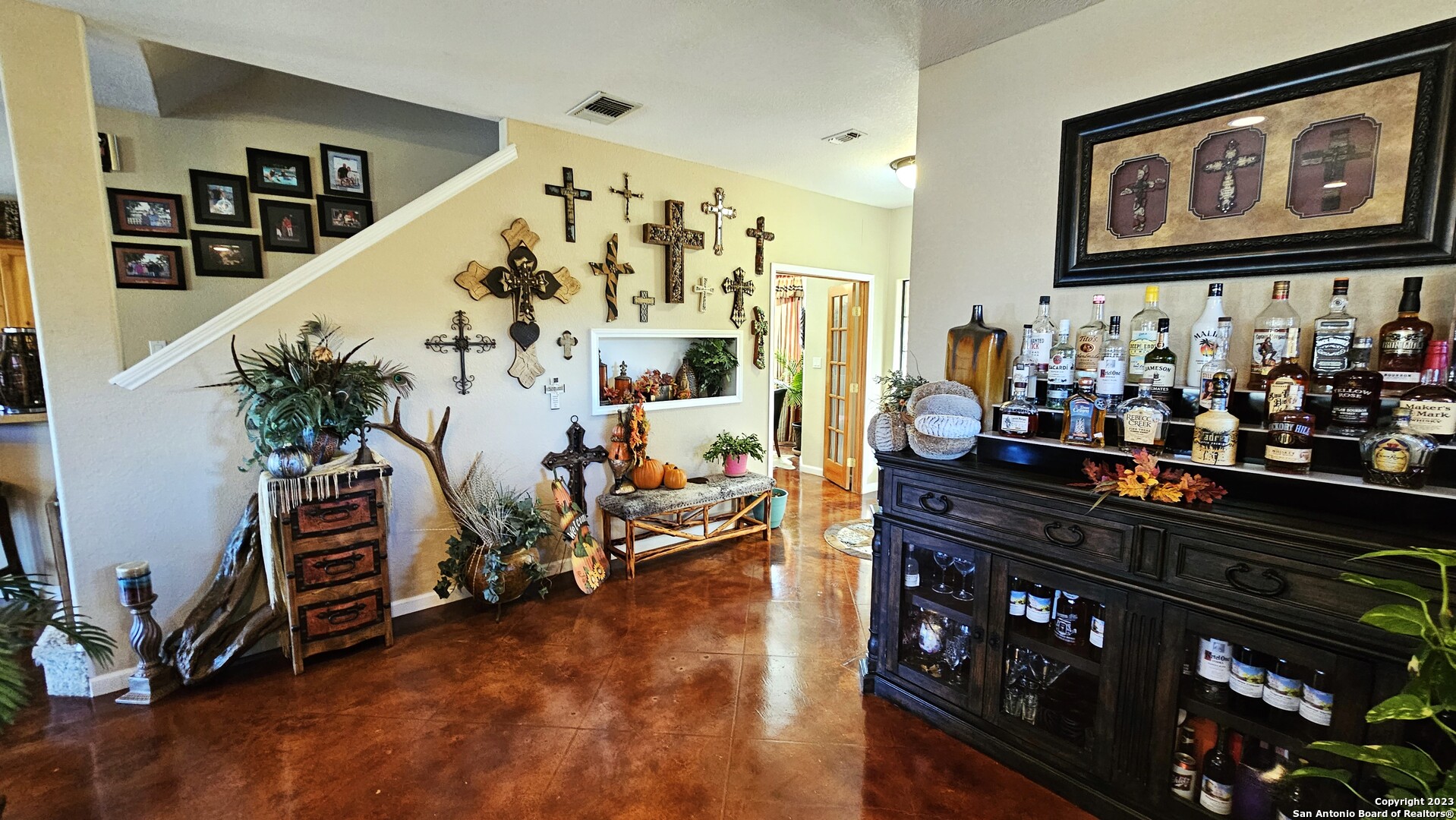 3245 Fm 470 Bandera, TX 78003 - Photo 32 of 58 a view of a room with lots of frames on wall and paintings on the wall