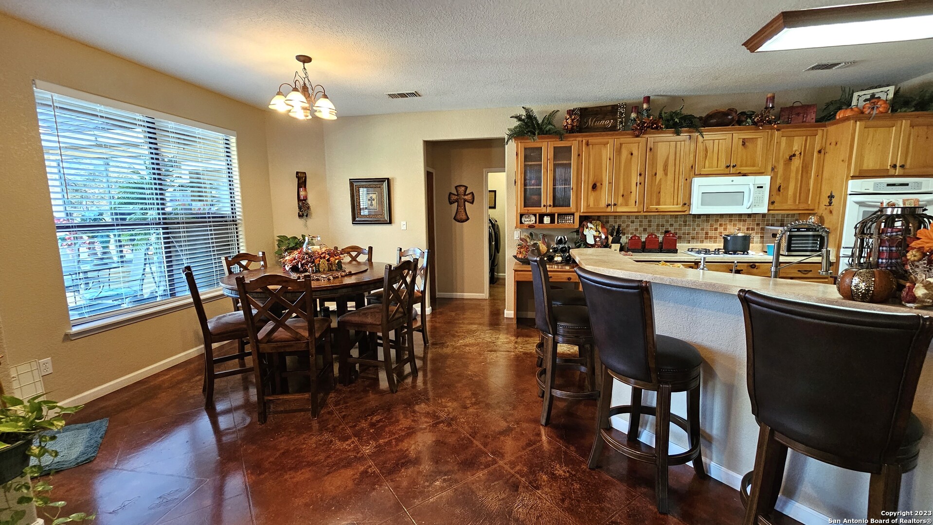3245 Fm 470 Bandera, TX 78003 - Photo 34 of 58 a view of a dining room with furniture and wooden floor