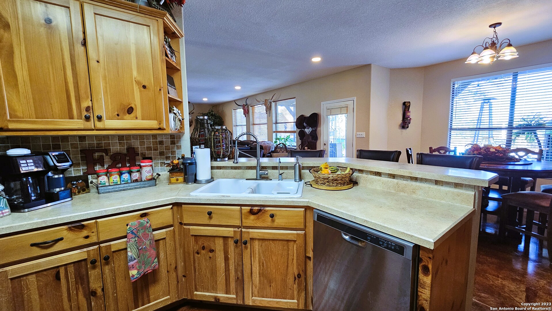 3245 Fm 470 Bandera, TX 78003 - Photo 35 of 58 a kitchen with stainless steel appliances granite countertop a sink and cabinets