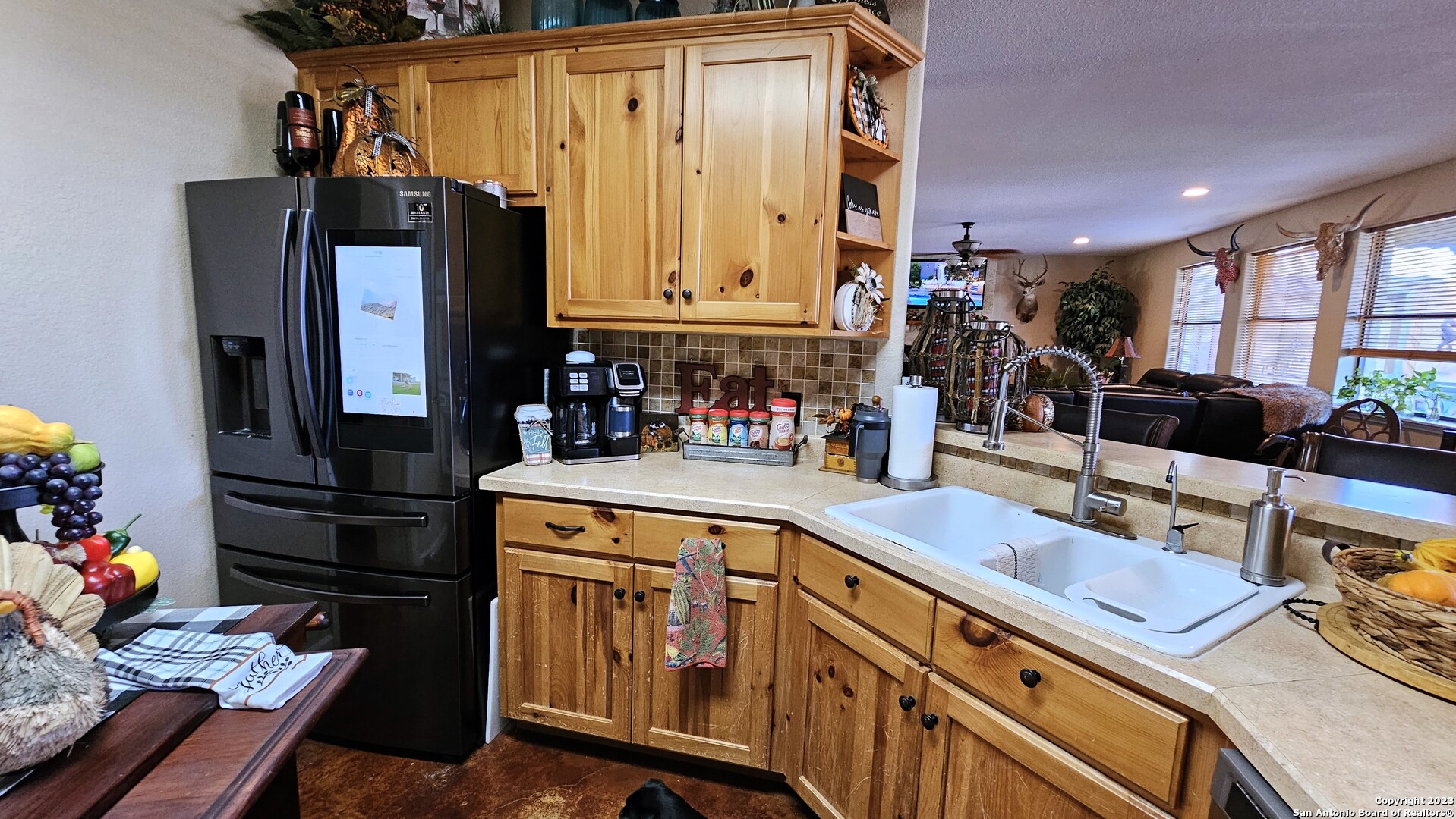 3245 Fm 470 Bandera, TX 78003 - Photo 36 of 58 a kitchen with stainless steel appliances granite countertop a sink stove and refrigerator