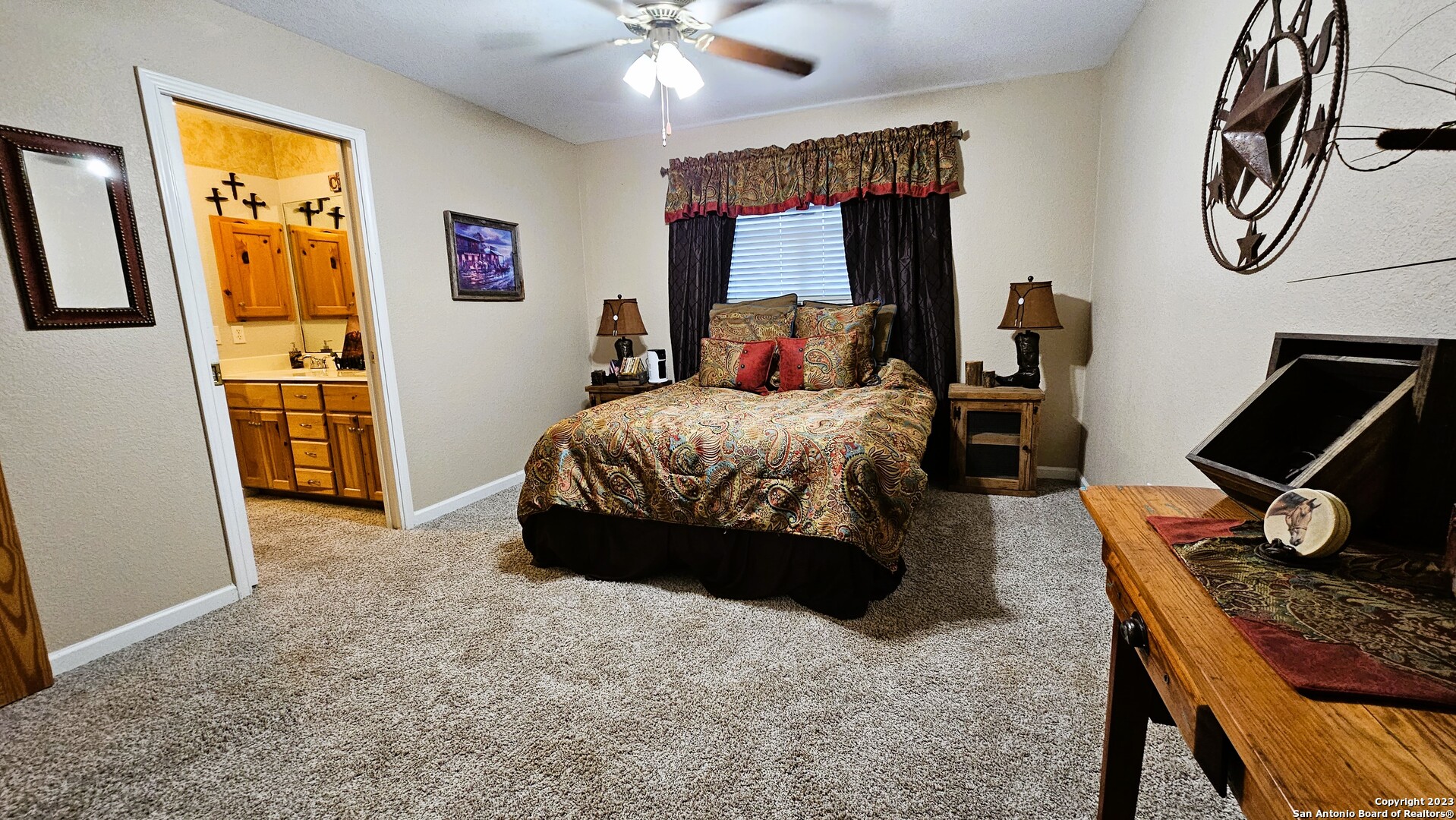 3245 Fm 470 Bandera, TX 78003 - Photo 54 of 58 a bedroom with a bed and wooden floor