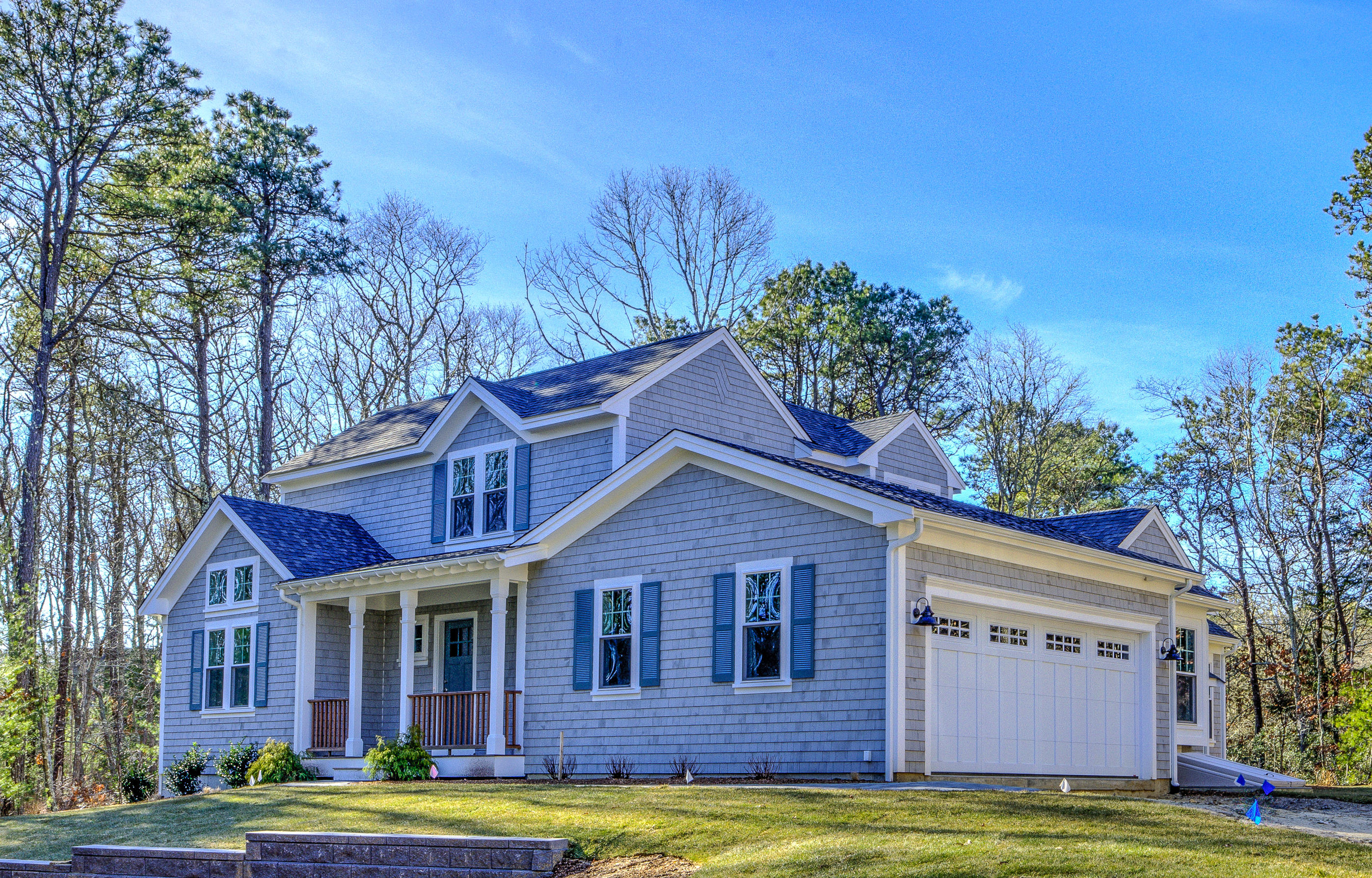 17 Alma Road Mashpee, MA 02649 - Photo 1 of 21 a view of a yard in front of a brick house with large windows