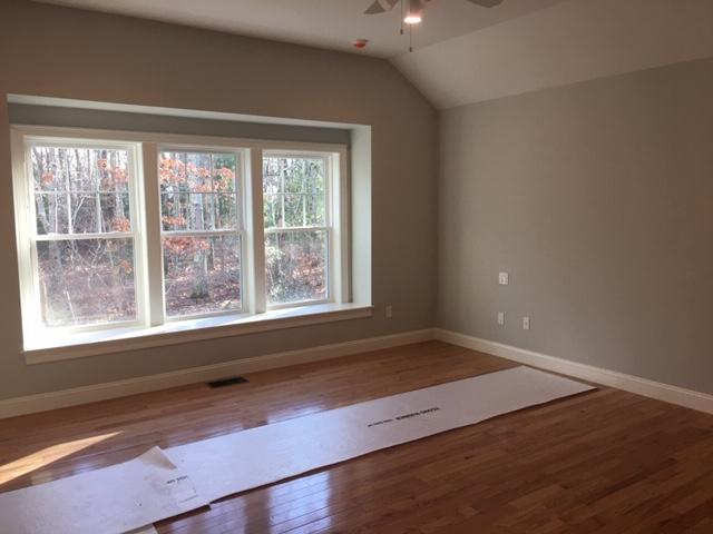 17 Alma Road Mashpee, MA 02649 - Photo 15 of 21 an empty room with wooden floor and windows