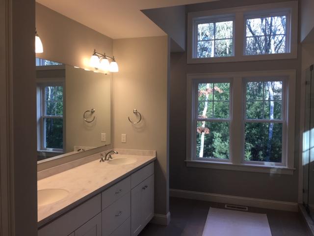 17 Alma Road Mashpee, MA 02649 - Photo 16 of 21 a bathroom with double vanity and a mirror