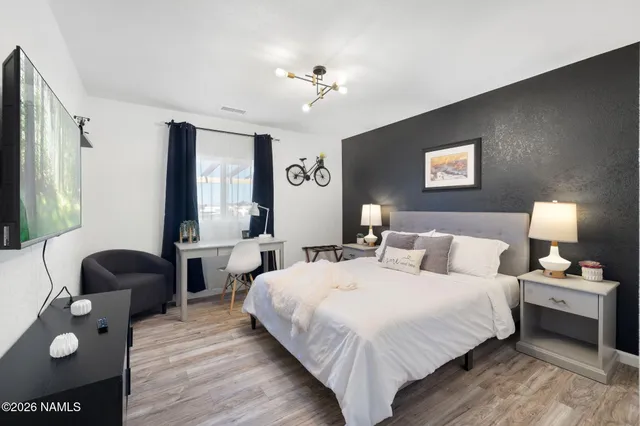 a bedroom with bed and a couch