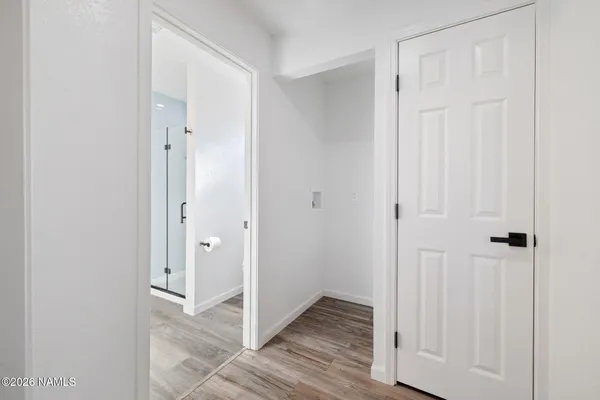 a view of a bathroom with wooden floor