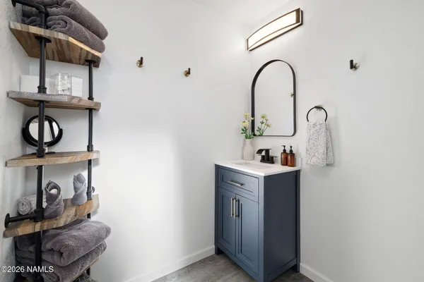 a bathroom with a sink and a mirror