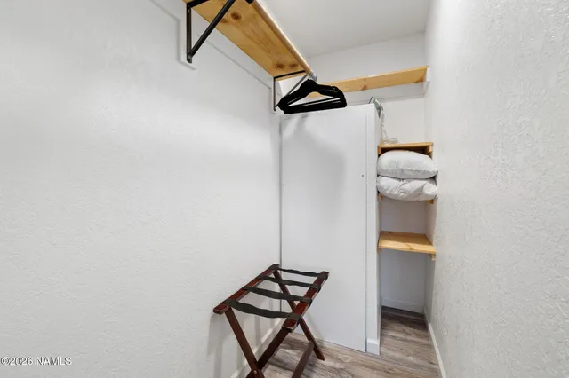 a view of entryway with wooden floor