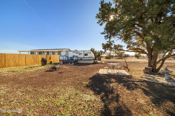 a view of a patio with a yard