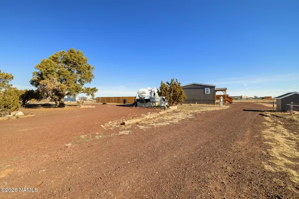 a view of car parked on the side of the road