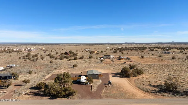 an aerial view of beach with ocean view