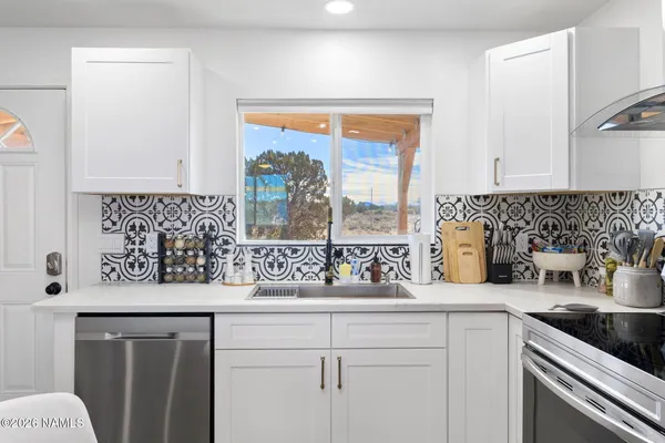 a kitchen with a sink and a window