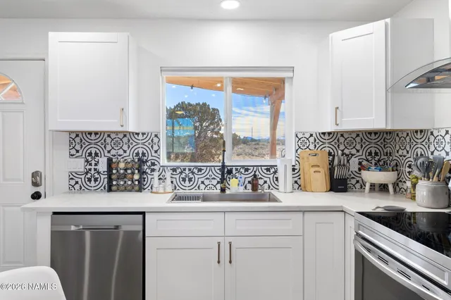 a kitchen with a sink and a window