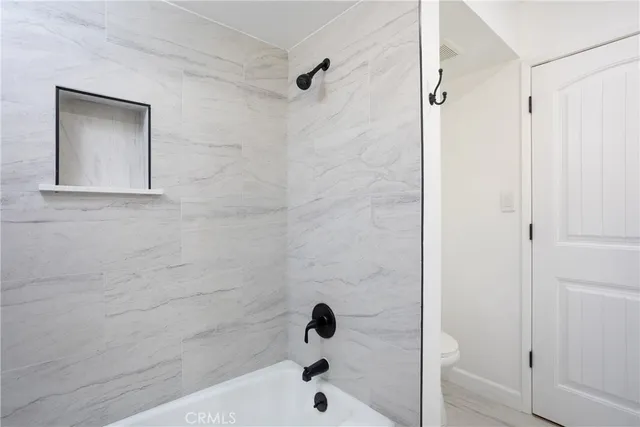 a bathroom with a double vanity sink and mirror
