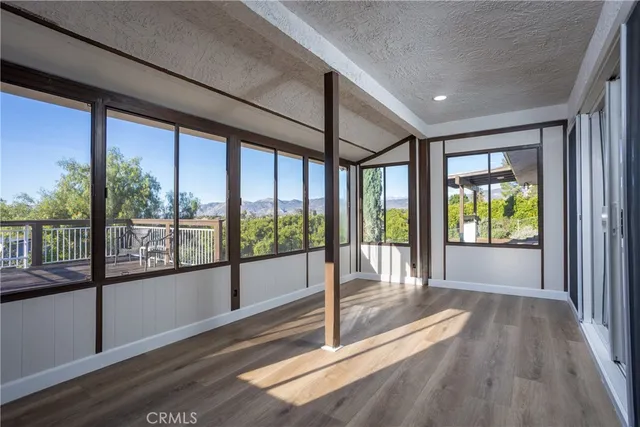 a kitchen with granite countertop white cabinets and a sink
