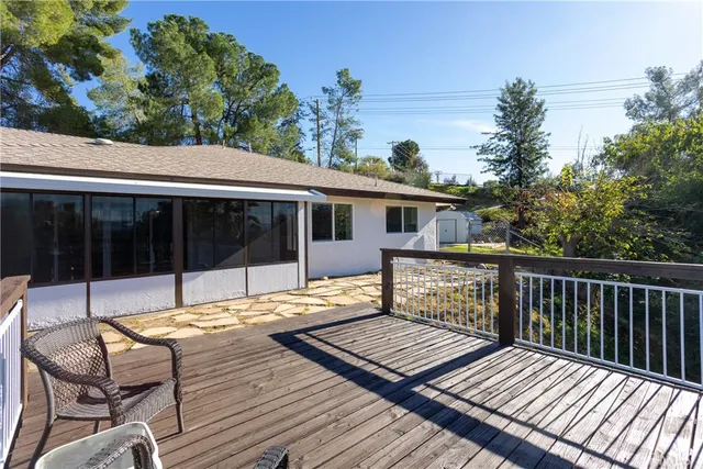 a view of a yard with potted plants