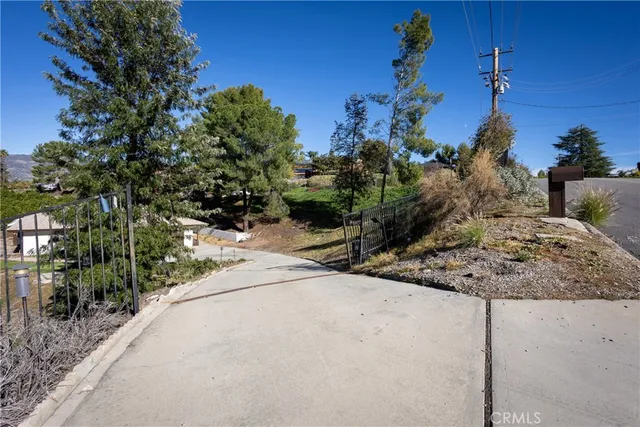 an aerial view of a house with a yard and garden