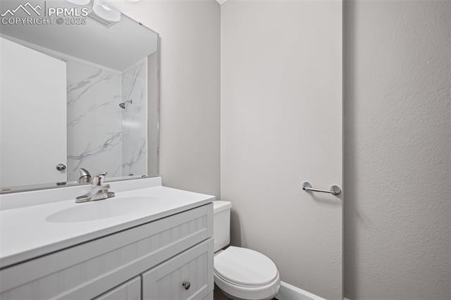 6319 Chippewa Road Colorado Springs, CO 80915 - Photo 30 of 36 Bathroom with vanity and toilet