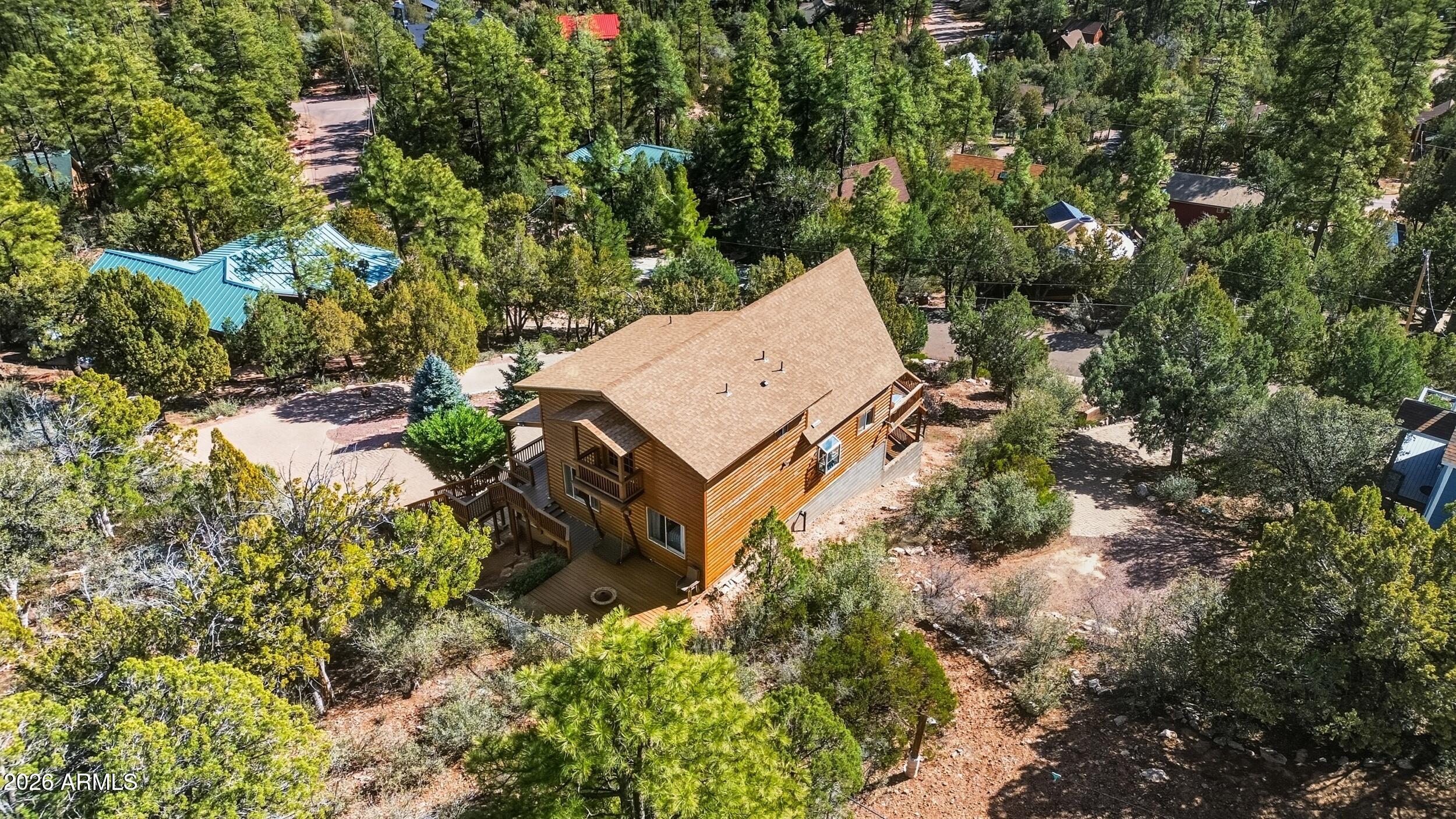 3119 Kysar Way Pine, AZ 85544 - Photo 47 of 68 an aerial view of a house with a yard