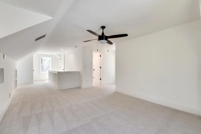 a bathroom with a tub a sink and mirror