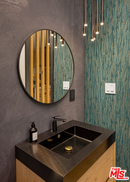 512 Rustic Drive Los Angeles, CA 90065 - Photo 20 of 53 a bathroom with a sink and mirror