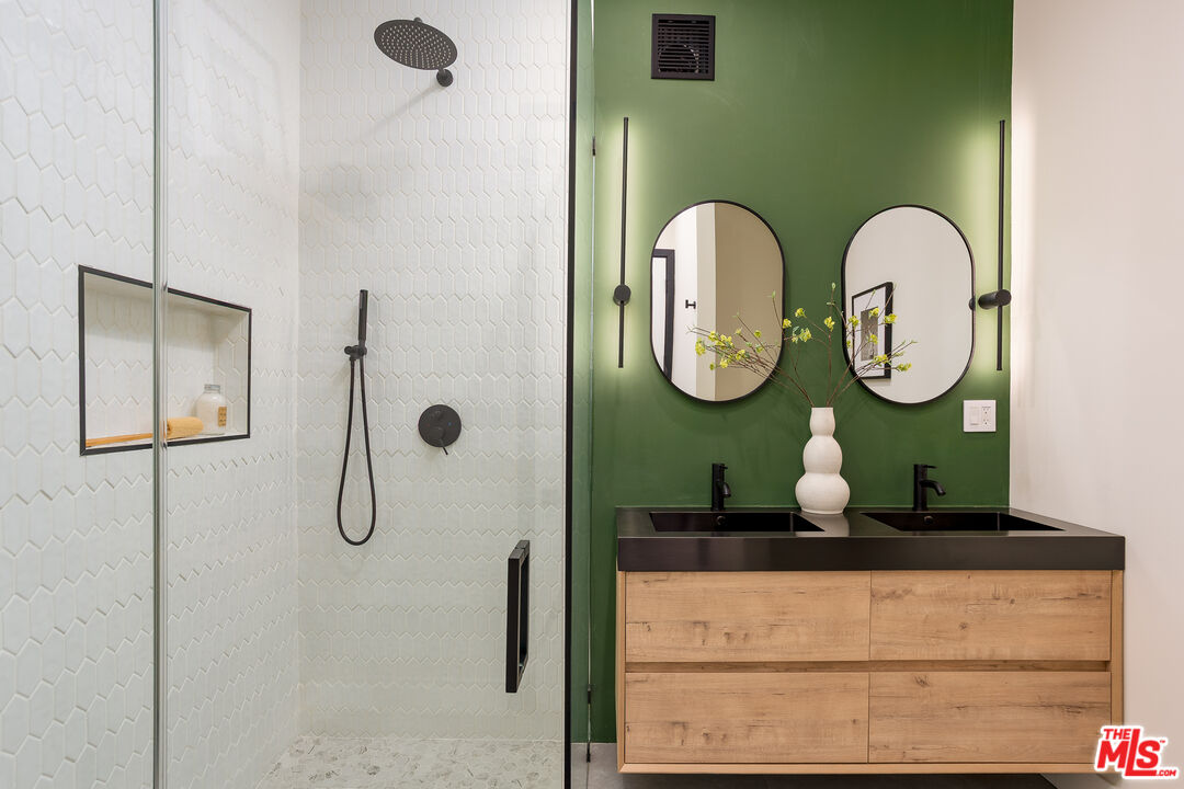 512 Rustic Drive Los Angeles, CA 90065 - Photo 24 of 53 a bathroom with a mirror and a sink