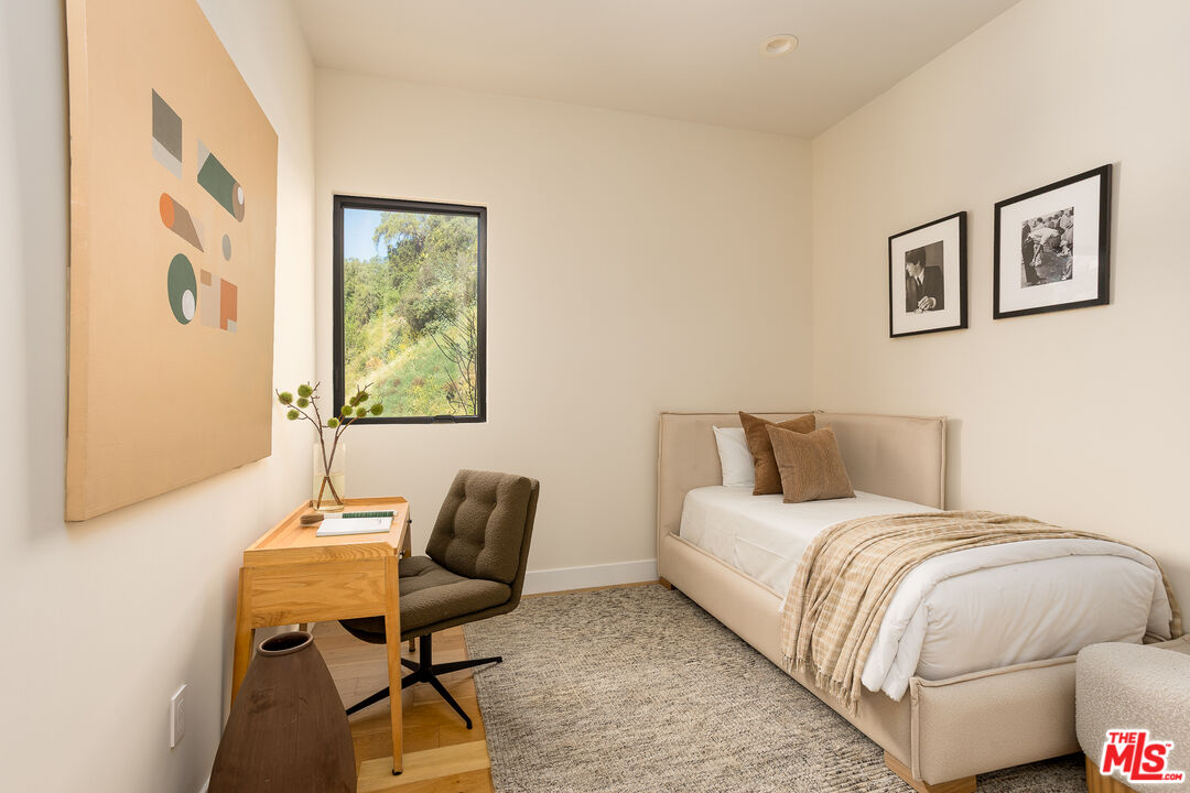 512 Rustic Drive Los Angeles, CA 90065 - Photo 26 of 53 a bedroom with a bed and wooden floor